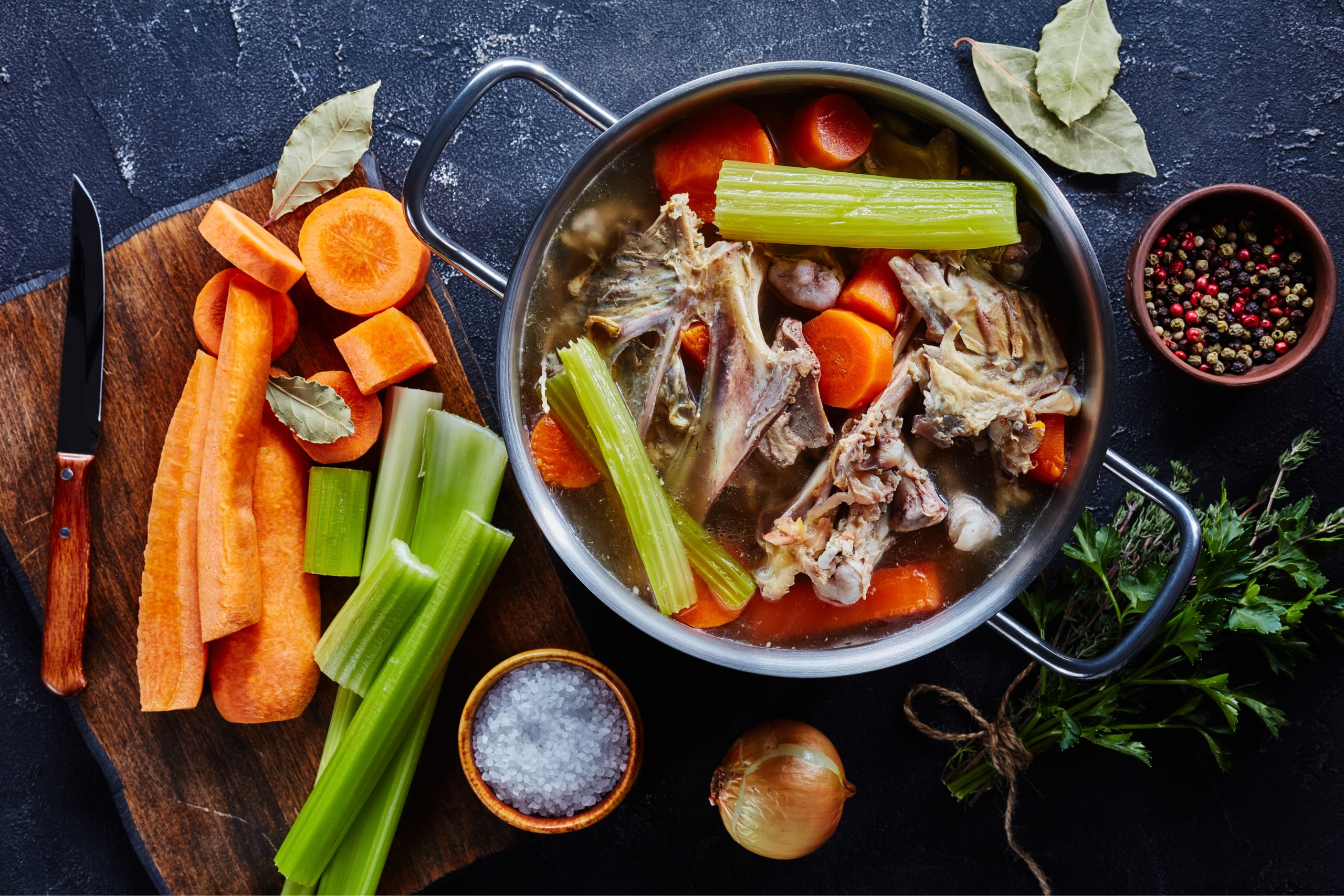 raw chicken bones, carrots, celery, onions, sea salt in a stock pot to make chicken stock, an upgraded bone broth with more nutrients